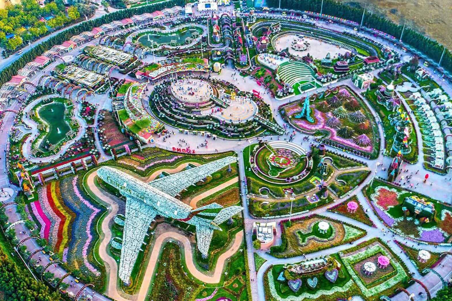 sky view of Dubai's Miracle Garden. Of note is a large plane sculpture covered in flowers and a colourful variety of flowers on display