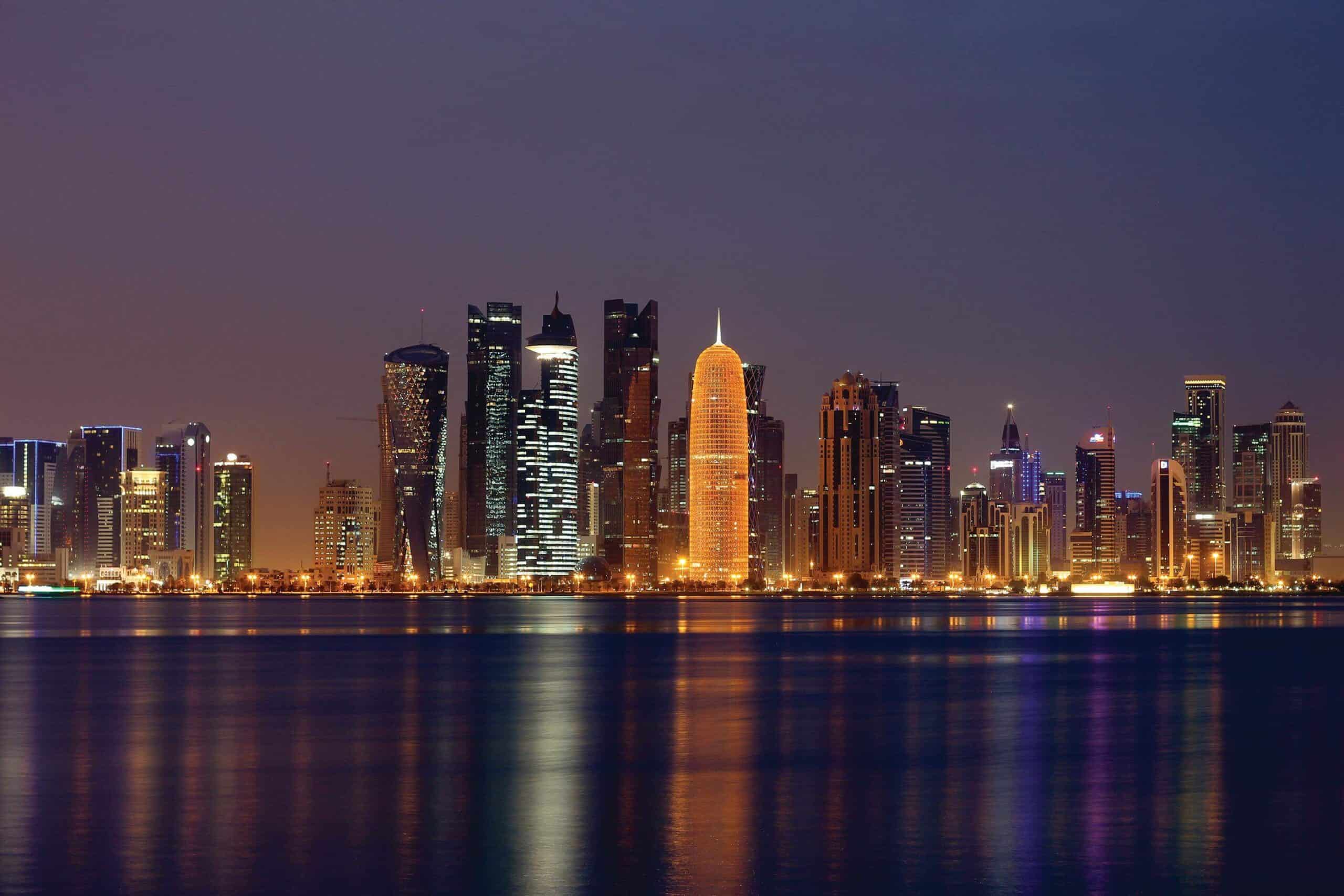 a cityscape of Doha by night