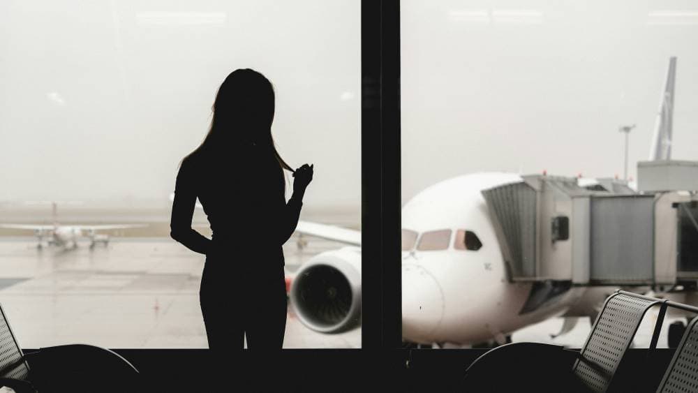 A woman standing in an airport