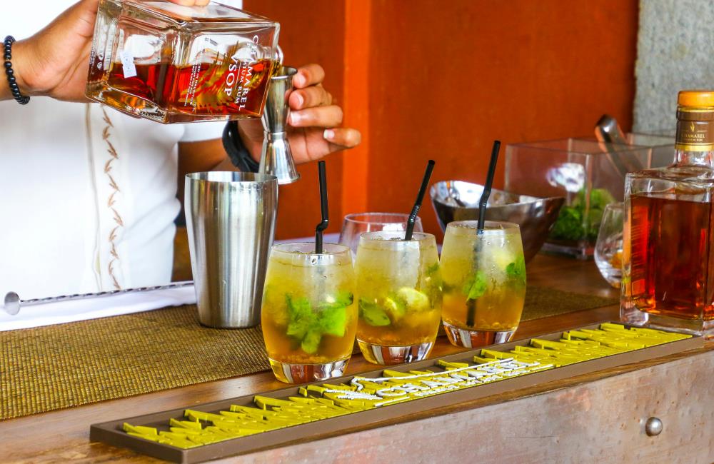 Person Preparing Rum Drink
