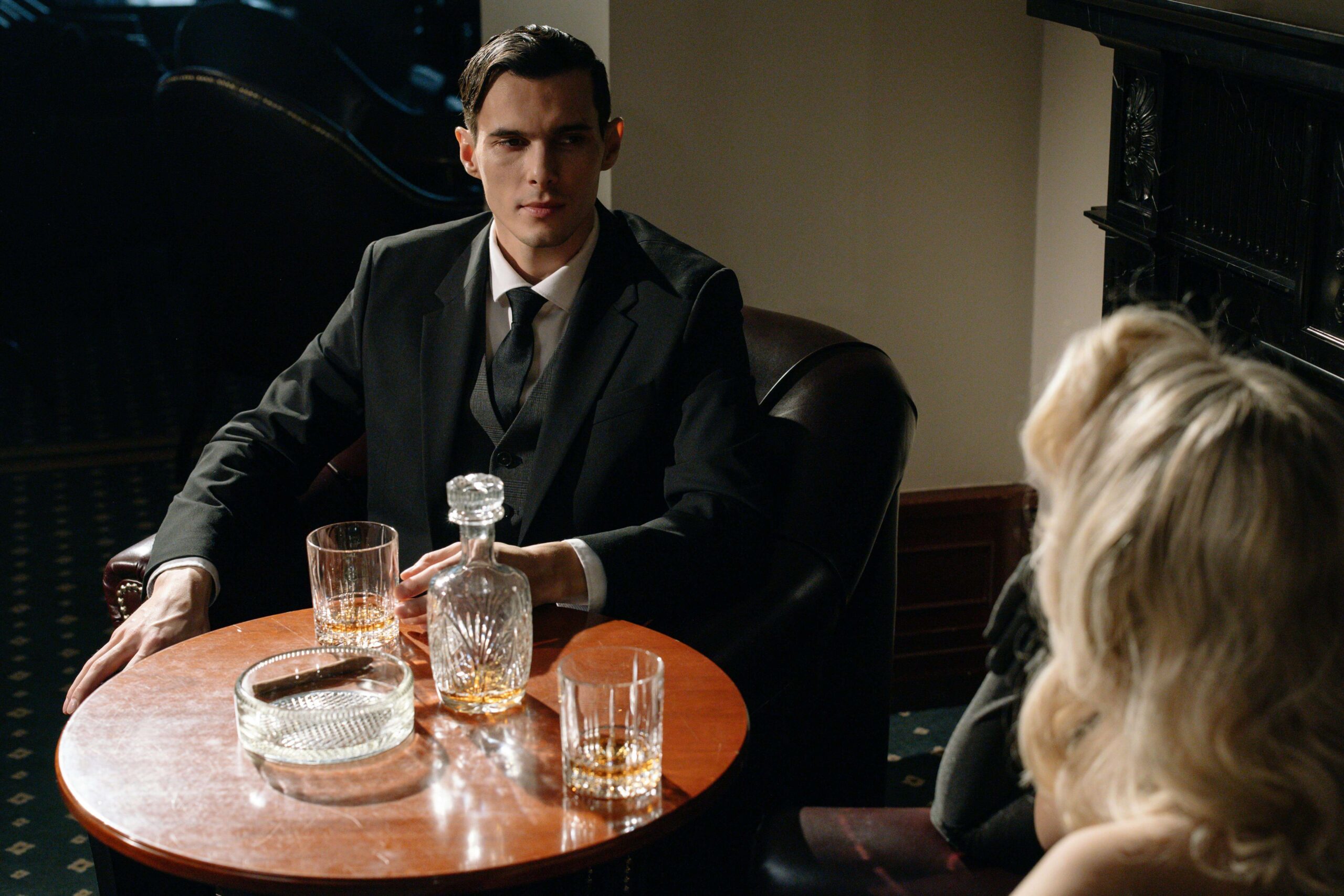 a businessman sitting at a table with a woman