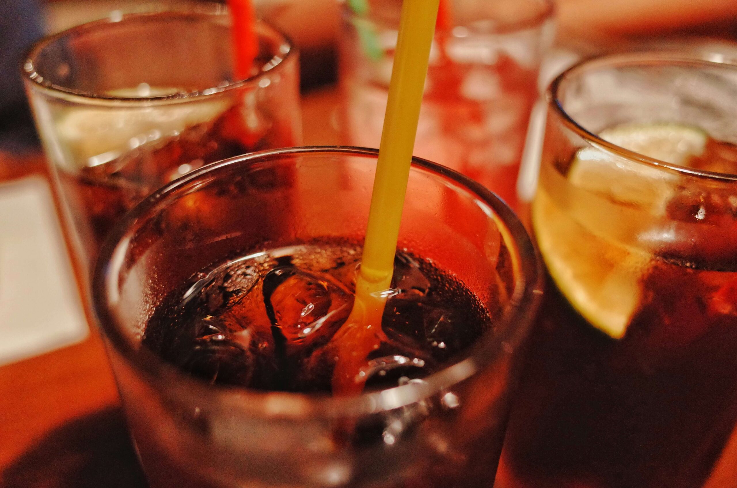 several glasses of drinks in a bar